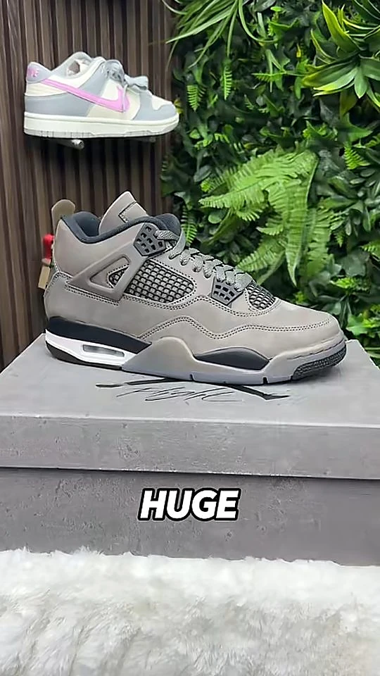 Laced Up sneaker content, a grey Jordan 4 on the box